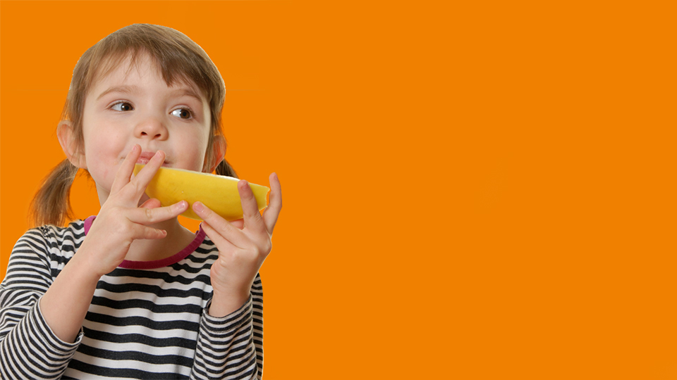 child eating an orange